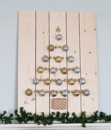 Christmas tree made out of silver and gold ornaments
