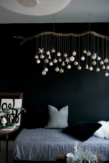 DIY branch with hanging gold and silver ornaments