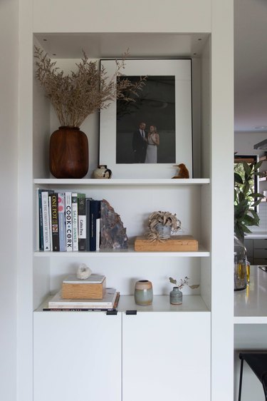 Living room nook with decor accessories and dried plant