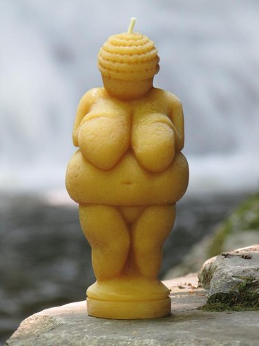 candle in the shape of a woman's figure
