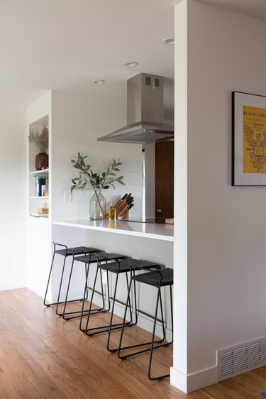 Breakfast bar gathering spot with barstools by M.A.D. Furniture.