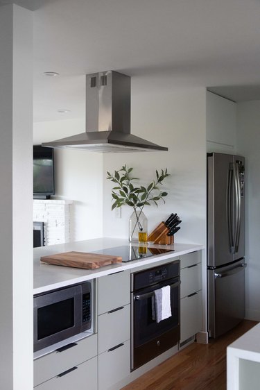 The kitchen featuring GE Appliances opening into the living room.