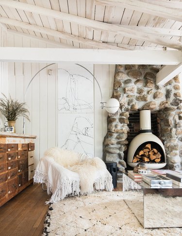 farmhouse fireplace with stone fireplace surround