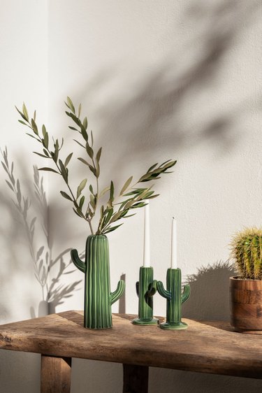 ceramic cactus-shaped pot and two candlesticks