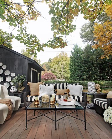 Outdoor living room small patio ideas with vintage-inspired decor and black and white furniture