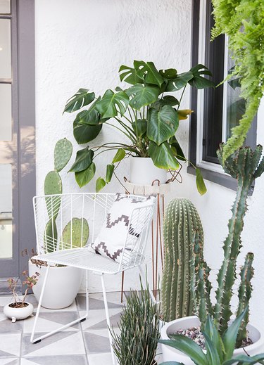 Nook small patio ideas with white decor and outdoor plants