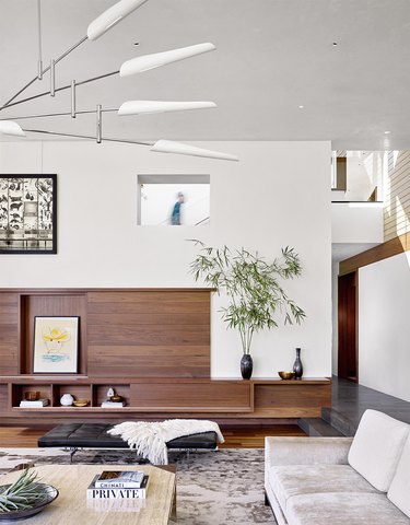 minimal white living room with wood paneling