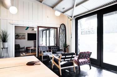 Ping pong table, surfboard in modern office/studio