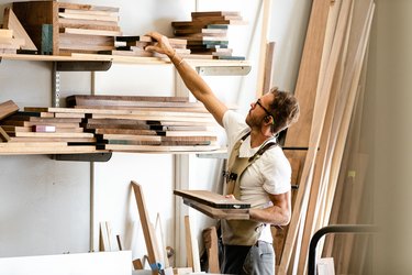 Wood materials and woodworker in studio