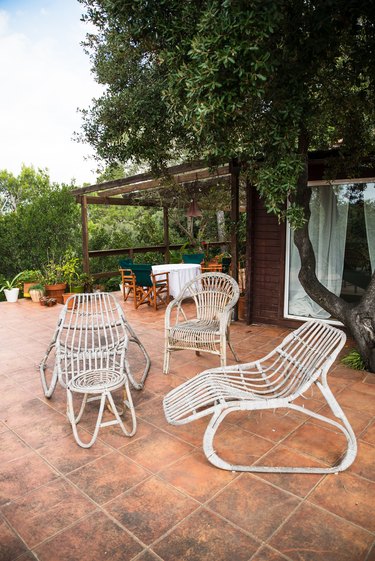 Rattan white chairs on patio