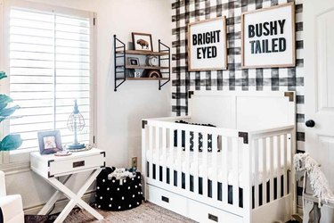 Plaid nursery idea with white crib and area rug