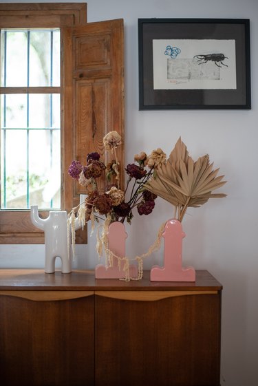 Pink vases with dried flowers