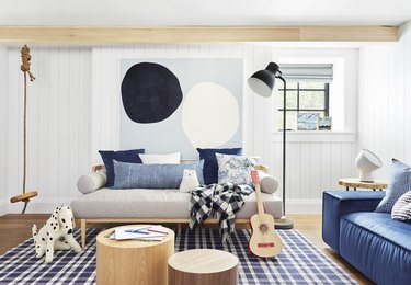 Cali-cool kids playroom idea with exposed wood beams at ceiling and hanging swing