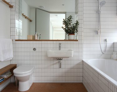 minimalist white bathroom with cork flooring
