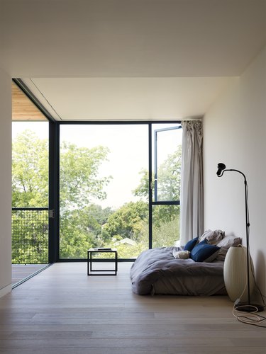 minimalist bedroom with large windows