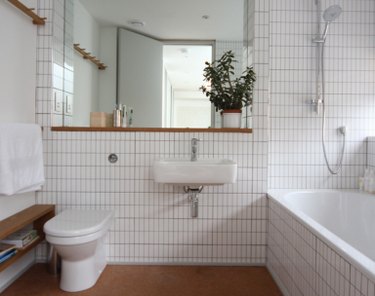 minimalist white bathroom with cork flooring