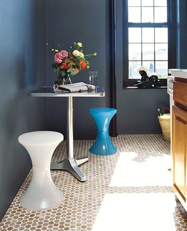 blue bathroom with round cork penny tile flooring