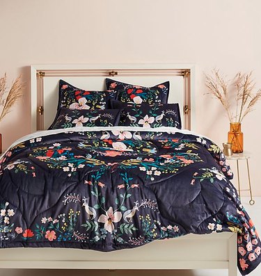 bed with floral patterned sheets