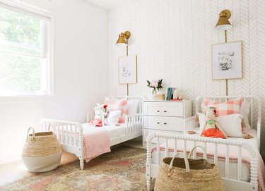 kids' bedroom idea with white furniture and brass sconces