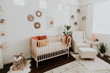modern nursery idea with neutral color scheme and potted plants