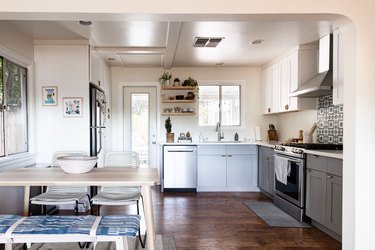 kitchen with slate blue cabinets and hardwood floors