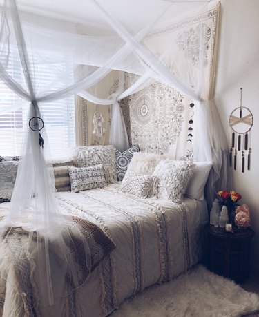 bohemian bedroom idea with layered textiles and bohemian decor in bedroom