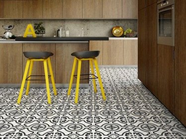 modern kitchen with dark wood cabinets and ceramic floor tile