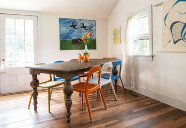 dining room with hardwood floor and modern art