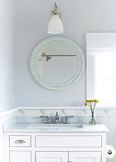 Bathroom backsplash idea with narrow piece of gray marble to match countertop