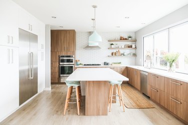 mint green kitchen idea with wood cabinets and mint accents