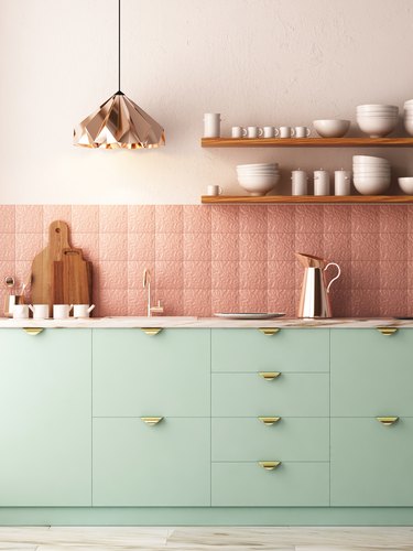 mint green kitchen with rose gold backsplash and open shelving