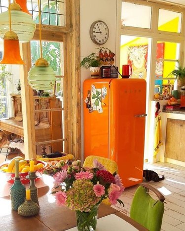 orange kitchen color idea with Smeg retro refrigerator