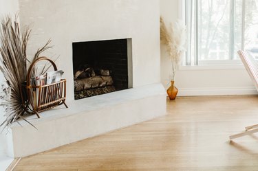 wood floor in living room with fireplace