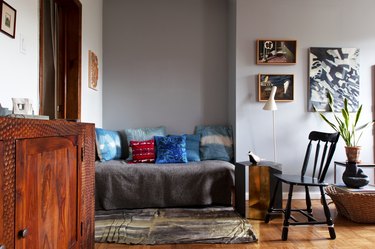 living room space with couch and black chair