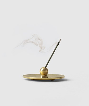 incense in brass holder