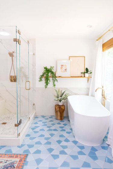 gray bathroom backsplash idea with marble behind freestanding bathtub