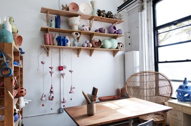 studio space with wood table and wooden shelves