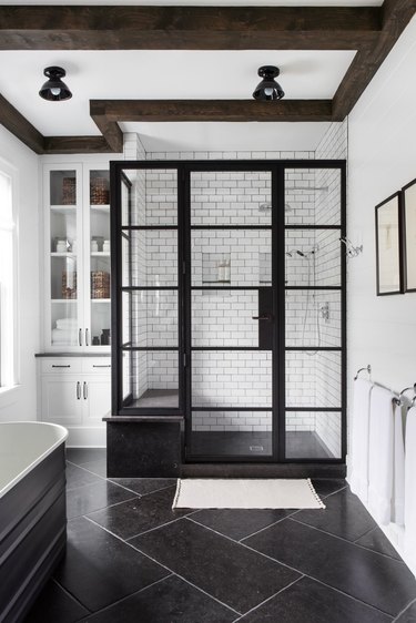 white and black bathroom with black steel framed glass shower doors