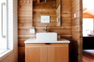 This cabin in Canada has some local wood used as a backsplash.