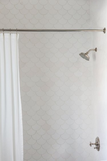 white scalloped shower tile