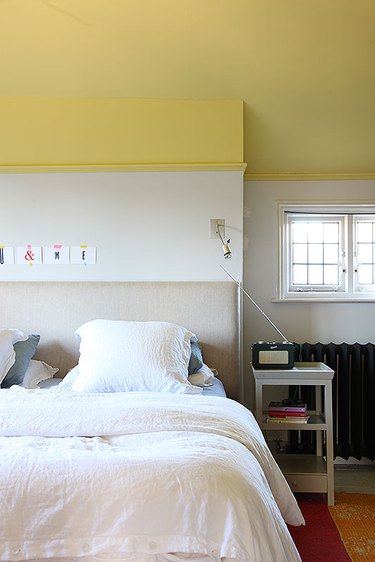 bedroom with yellow ceiling