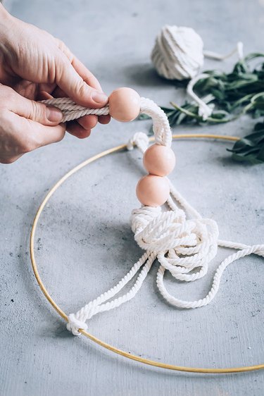 Stringing beads on DIY Herb Drying Rack