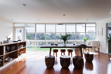 dining room with wood floors and floor to ceiling windows
