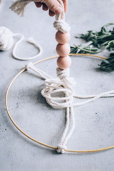 Adding beads to herb drying rack