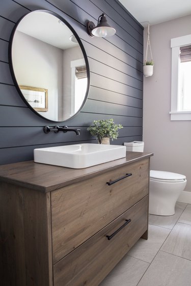 bathroom space with shiplap wall