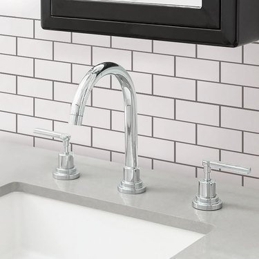 bathroom sink with peel and stick tiles