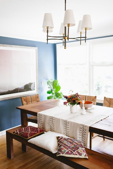 blue dining room with bench and dining chairs