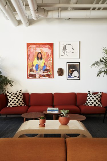 photo of couches and paintings on the wall