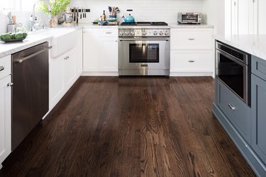 hardwood floor in kitchen, base cabinets, appliances