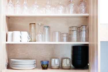 open cabinet with glassware